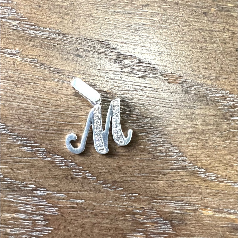 Silver letter M